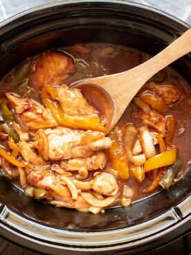 chicken tenders with bell peppers and onion in barbecue sauce.