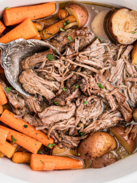 overhead shot of pot roast with a spoon in it.