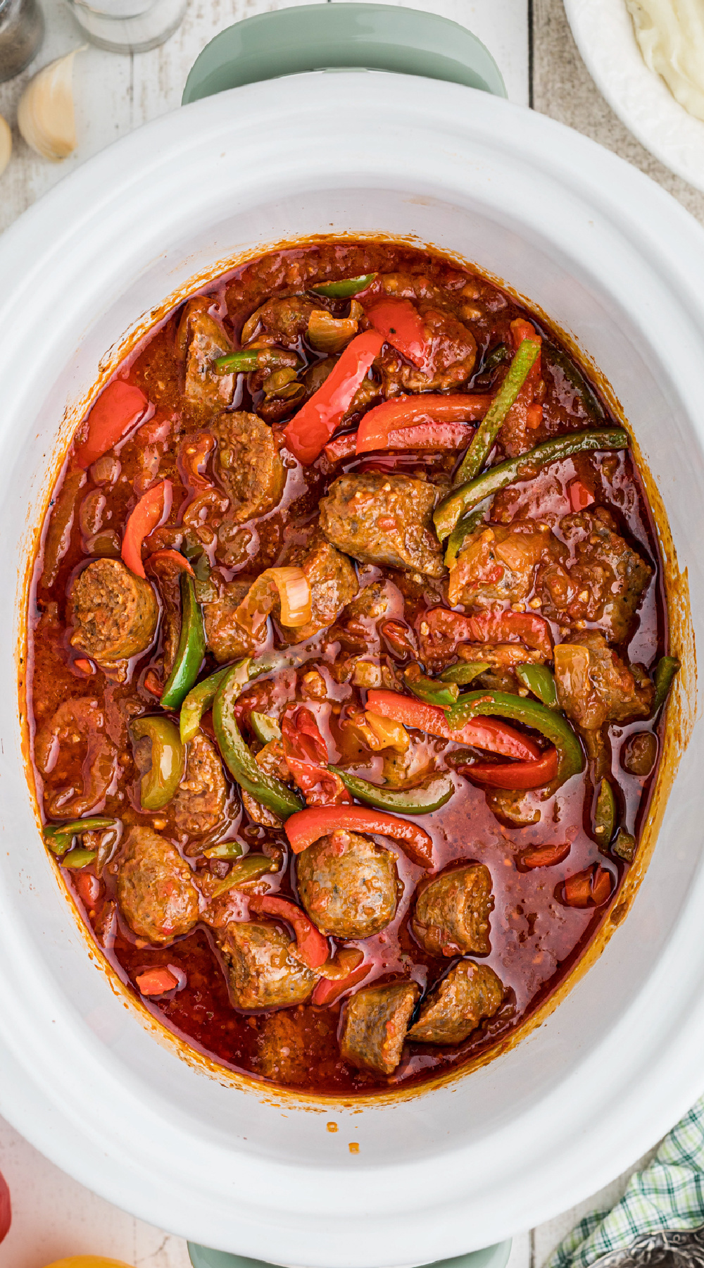 sausage and peppers in a slow cooker, for pinterest.