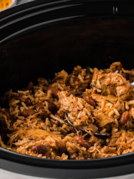 Pot of chicken, rice and beans.