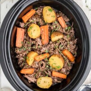 venison roast with vegeatbales in a slow cooker.